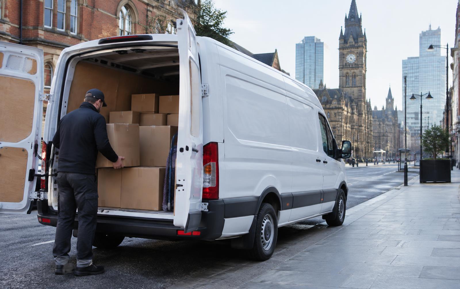 Unbranded white van being loaded in Manchester city centre